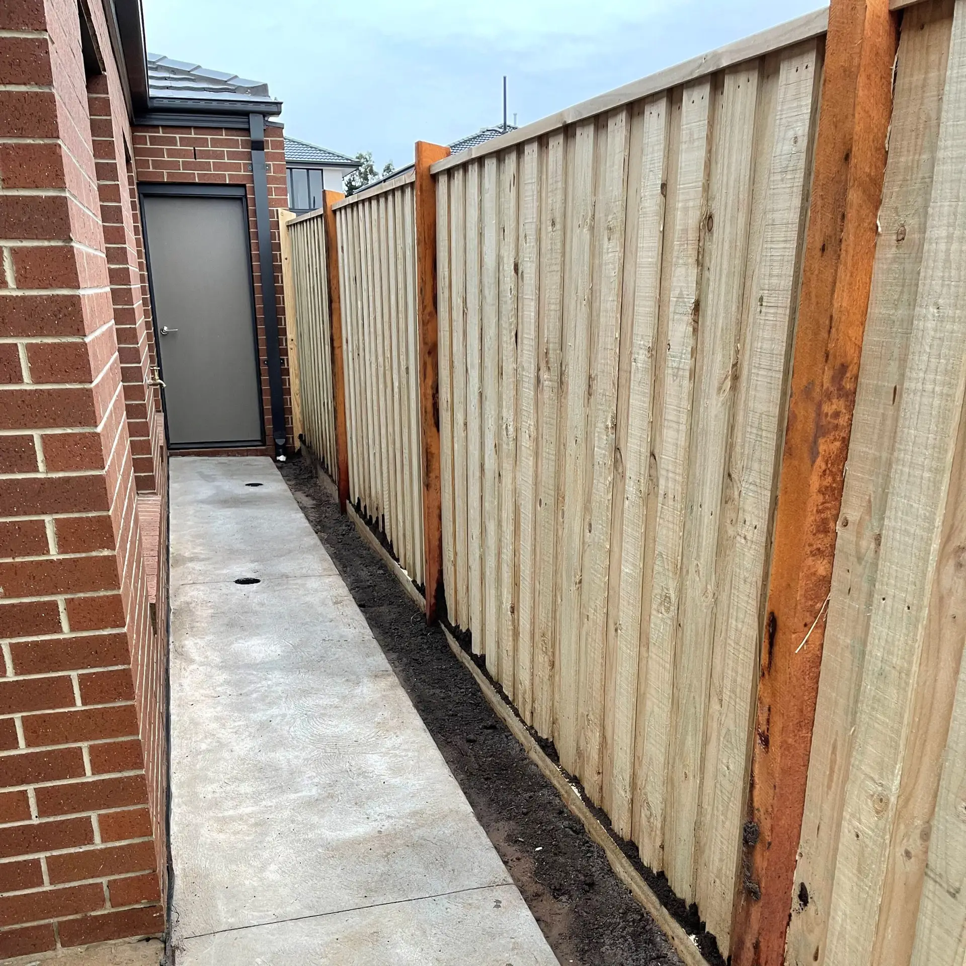 Timber Fence with Red Posts